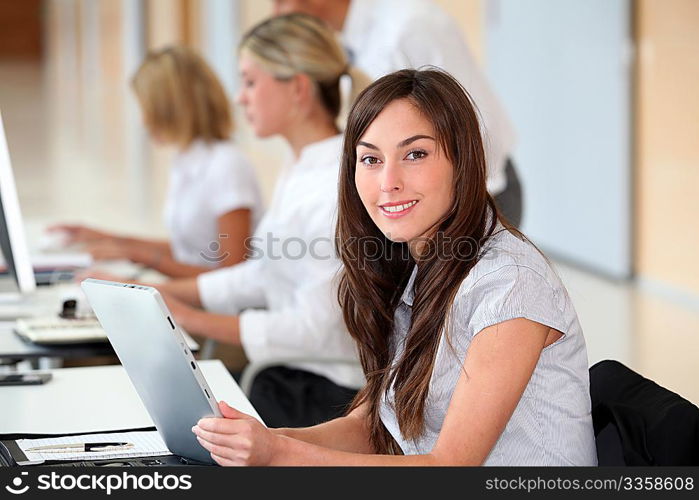 Businesswoman working in the office on electronic pad