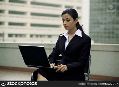Businesswoman working on a laptop