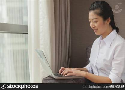 Businesswoman working on her laptop