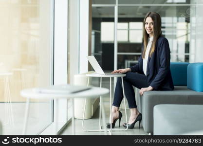 Businesswoman working on her laptop at the office