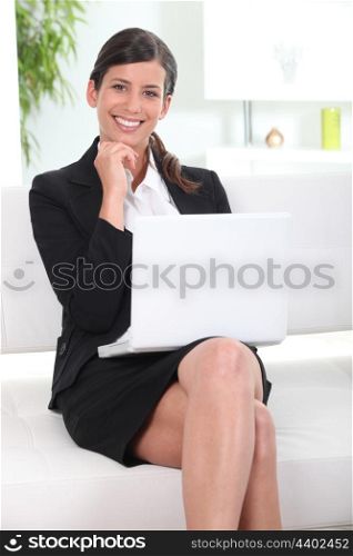 businesswoman working on her laptop in lobby