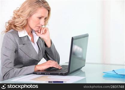 Businesswoman working on laptop