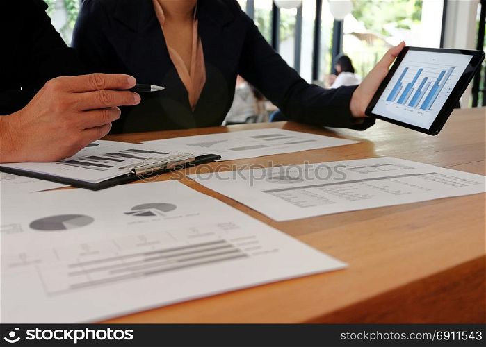 Businesswoman working on tablet laptop and cellphone connecting wifi. with Spreadsheet document information technology concept