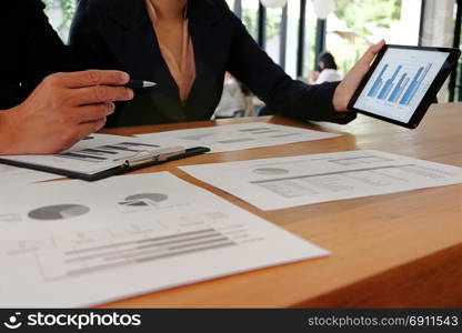 Businesswoman working on tablet laptop and cellphone connecting wifi. with Spreadsheet document information technology concept