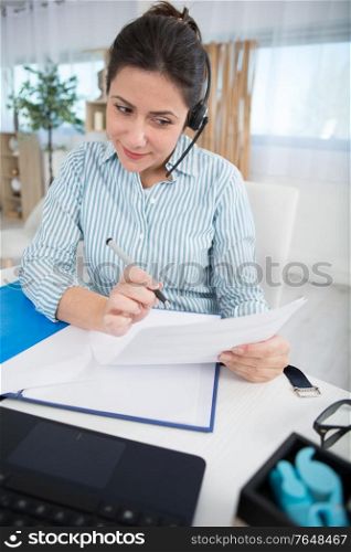 businesswoman working on the phone from home