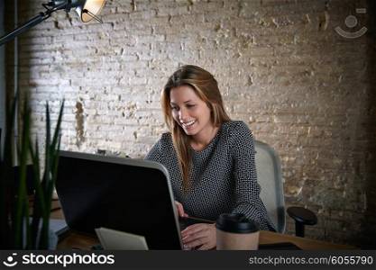 Businesswoman working with laptop computer at office