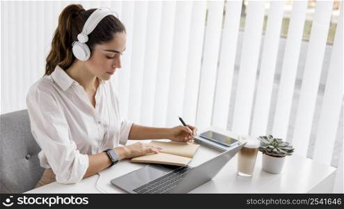 businesswoman working with laptop headphones