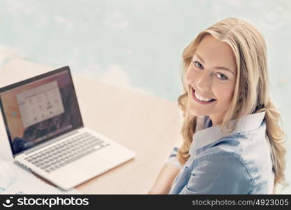 Businesswoman working with laptop in offfice