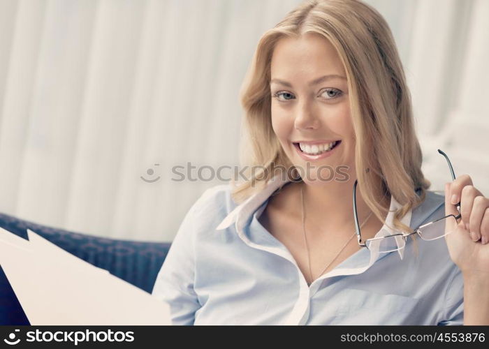 Businesswoman working with papers in offfice