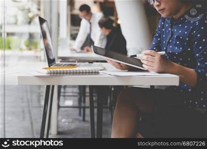 businesswoman working with tablet and laptop computer for use as office workplace concept