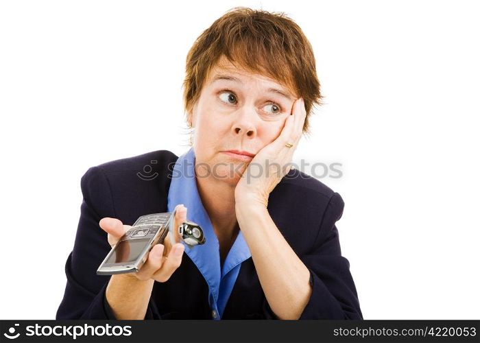 Businesswoman worried because no calls are coming in. Business at a standstill. Isolated on white.