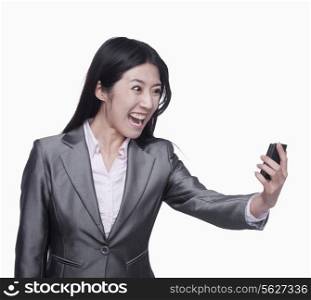 Businesswoman yelling at mobile phone