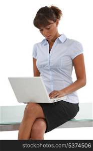 Businesswomanusing her laptop