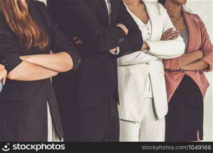 Businesswomen and businessman standing in row in office. Corporate business and teamwork concept.