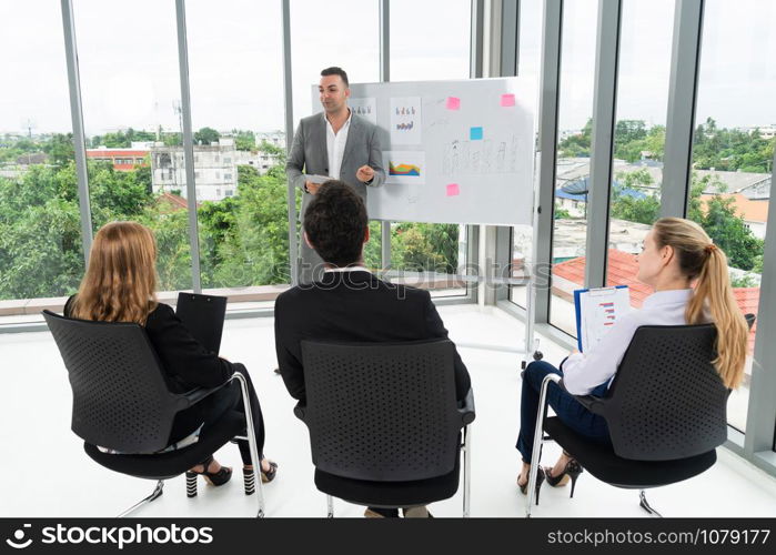 Businesswomen and businessmen attending group meeting conference in office room. Corporate business team concept.