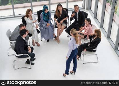 Businesswomen and businessmen attending group meeting conference in office room. Corporate business team concept.