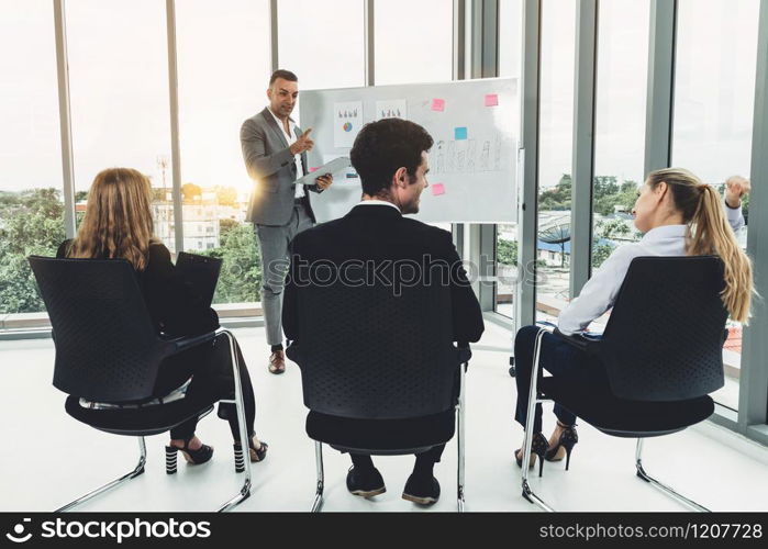 Businesswomen and businessmen attending group meeting conference in office room. Corporate business team concept.