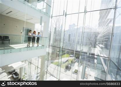 Businesswomen discussing at office balcony