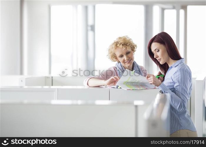 Businesswomen discussing in creative office
