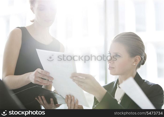 Businesswomen doing paperwork in office