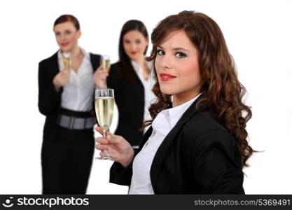 Businesswomen drinking champagne