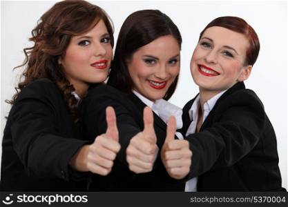 Businesswomen giving the thumb&rsquo;s up