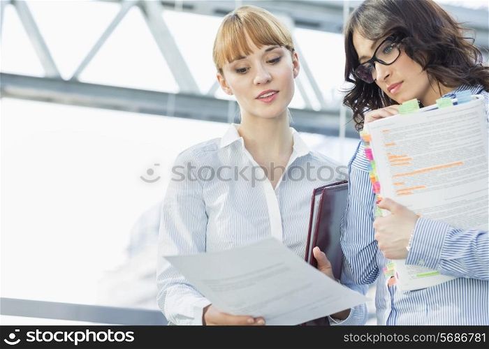 Businesswomen reading document in office
