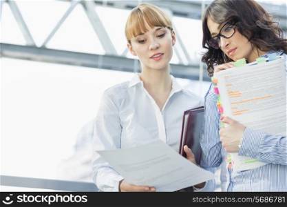 Businesswomen reading document in office