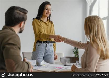 businesswomen shaking hands work