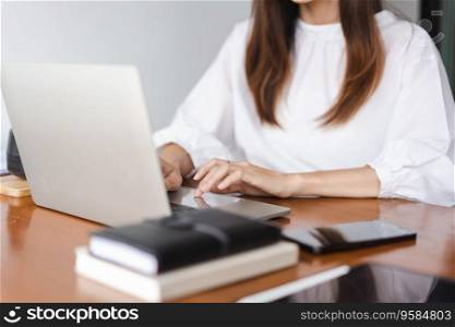Businesswomen typing data on keyboard of laptop and working about new startup in outside office.