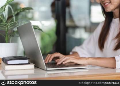Businesswomen use laptop to typing financial data on keyboard and working about new startup project.