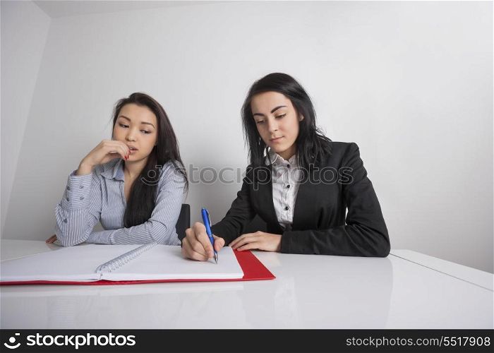 Businesswomen working at desk in office
