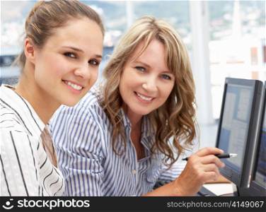 Businesswomen working on computers