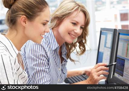Businesswomen working on computers