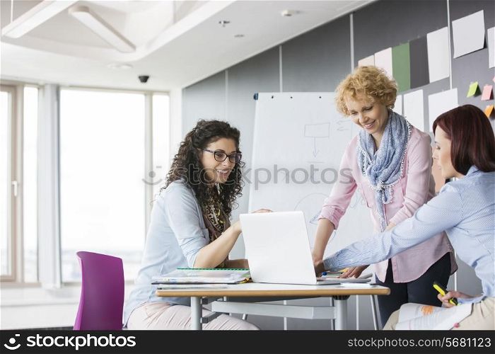 Businesswomen working together in creative office