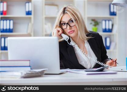 Busineswoman frustrated working in the office