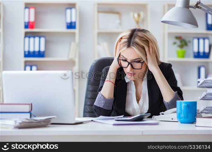 Busineswoman frustrated working in the office