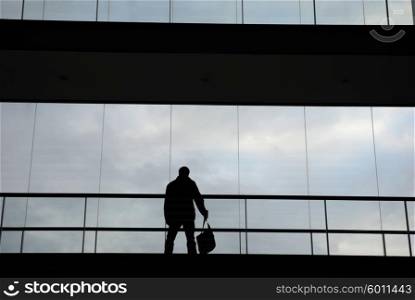 businness man in silhouette in a modern building