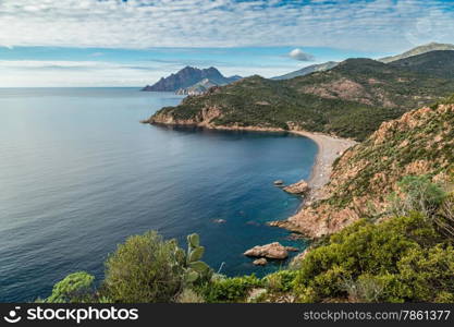 Bussaglia beach and distant mountains near Porto on west coast of Corsica