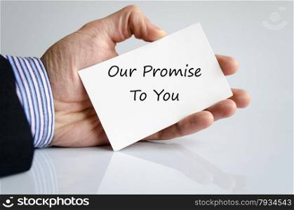 Bussines man hand with text Our promise to you