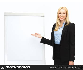 bussiness and education - businesswoman with flipchart in office