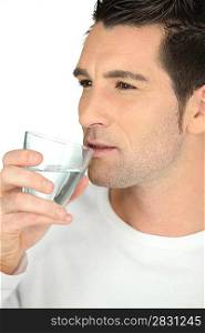 bust shot of man drinking glass of water