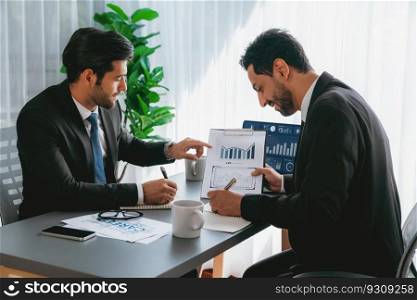 Busy analyst team discussing financial data on digital dashboard, analyzing chart and graph using data science software display on a laptop screen. Business intelligence and Fintech. Fervent. Busy analyst team discussing financial data on laptop. Fervent