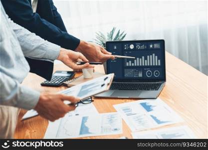 Busy analyst team in office analyzing financial data analysis for marketing strategy in workspace using BI dashboard with graph and chart on laptop screen to improve business performance. Entity. Busy analyst team in office analyzing financial data analysis. Entity