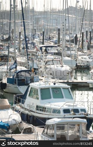 busy boating marina with lots of yachts and small pleasure craft - no product identification or names