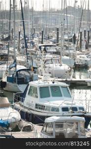 busy boating marina with lots of yachts and small pleasure craft - no product identification or names