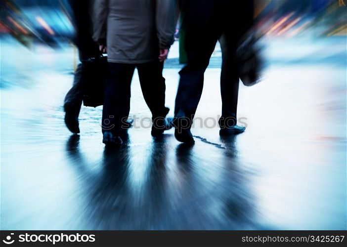 Busy business people walking. Motion blurred