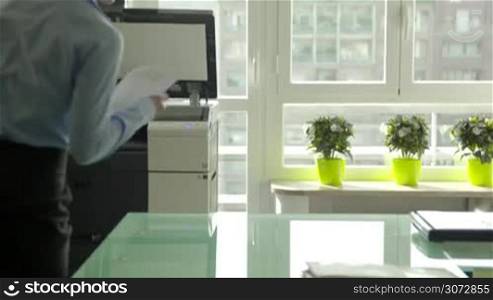 Busy business woman at work in office, businesswoman making copies of papers, manager using copier, beautiful secretary with photocopy machine and documents, girl working with photocopier at her job