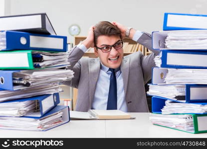 Busy businessman under stress due to excessive work