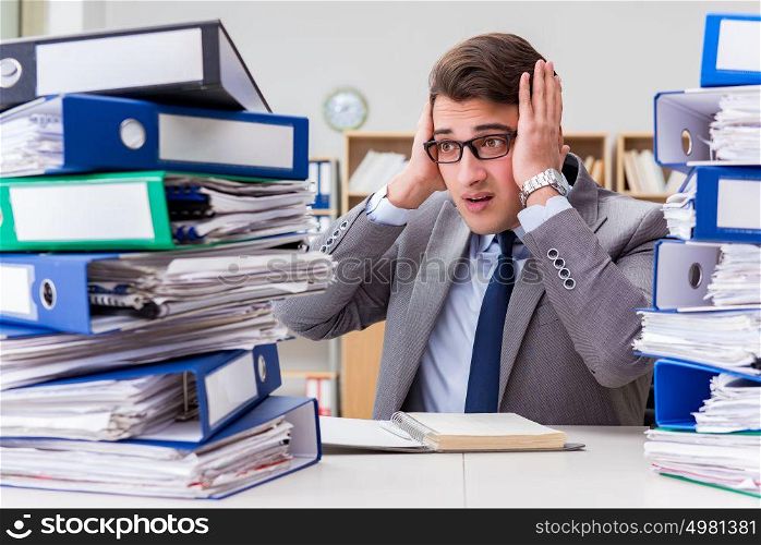 Busy businessman under stress due to excessive work